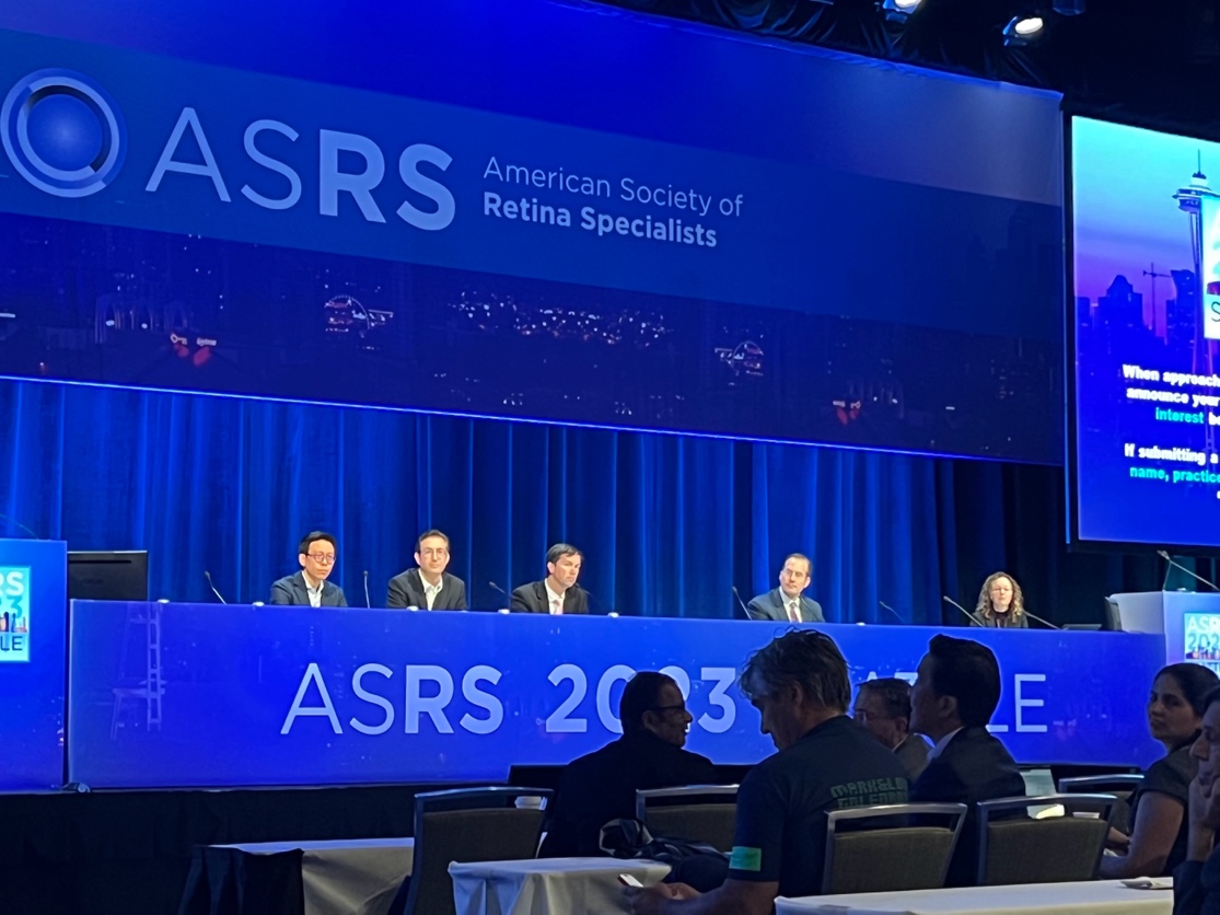 A group of people sitting at a table  Description automatically generated