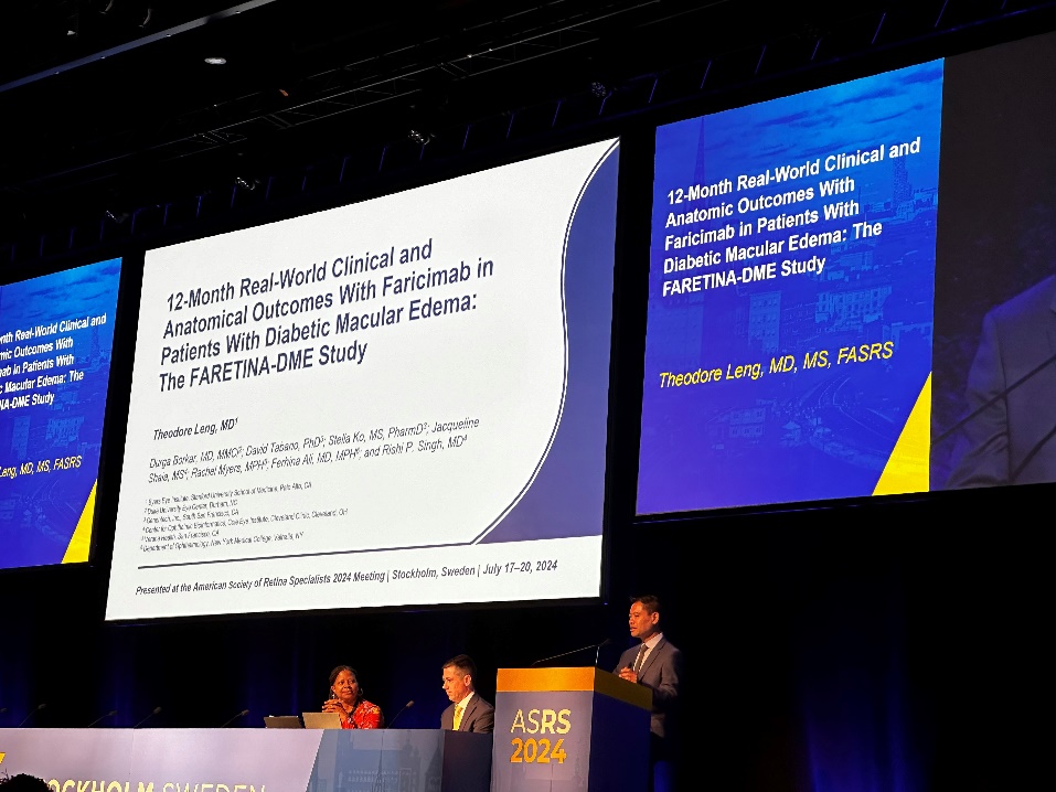 A group of people standing at a podium Description automatically generated