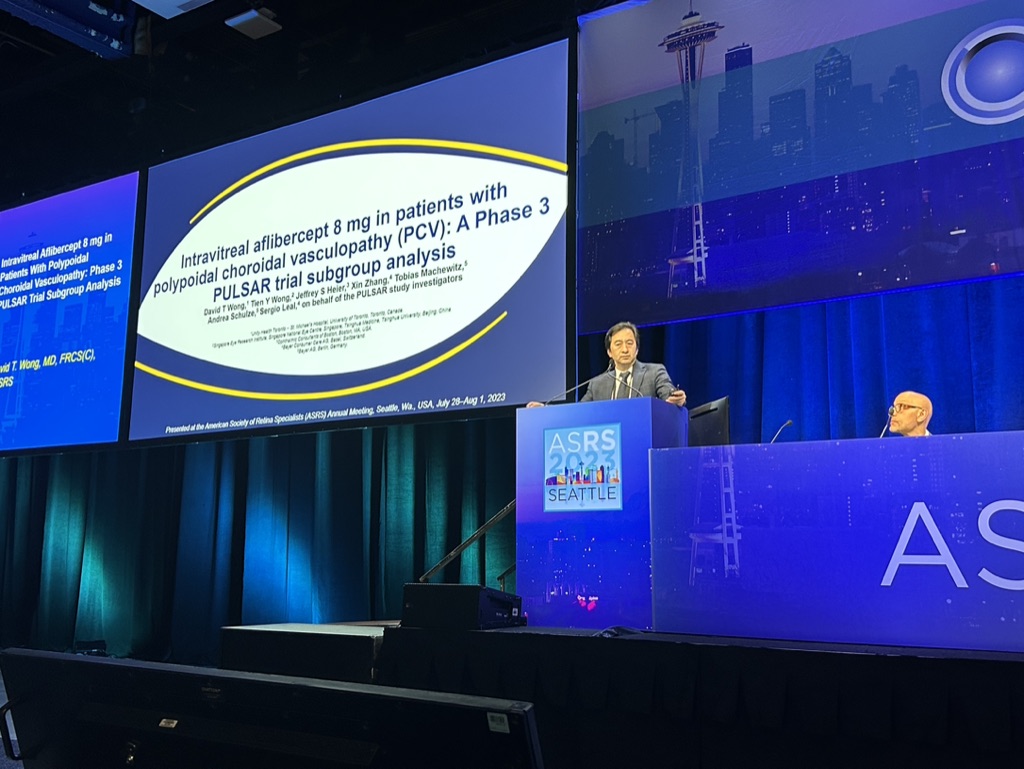 A person and person on stage Description automatically generated