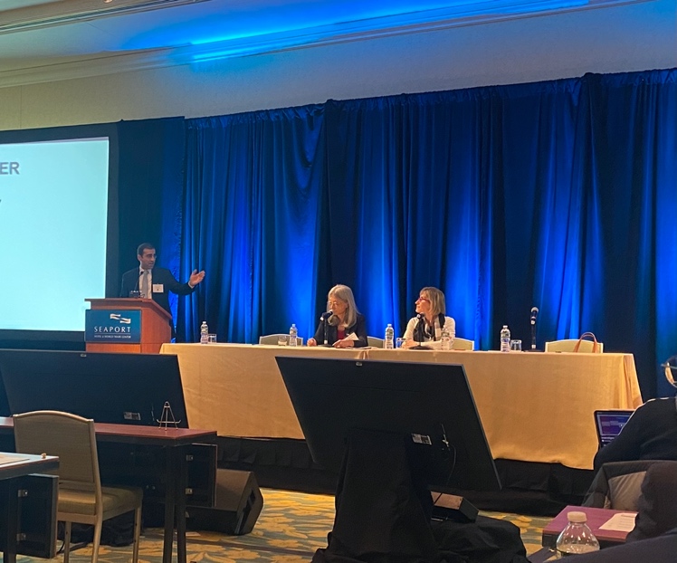 A person giving a presentation Description automatically generated with low confidence