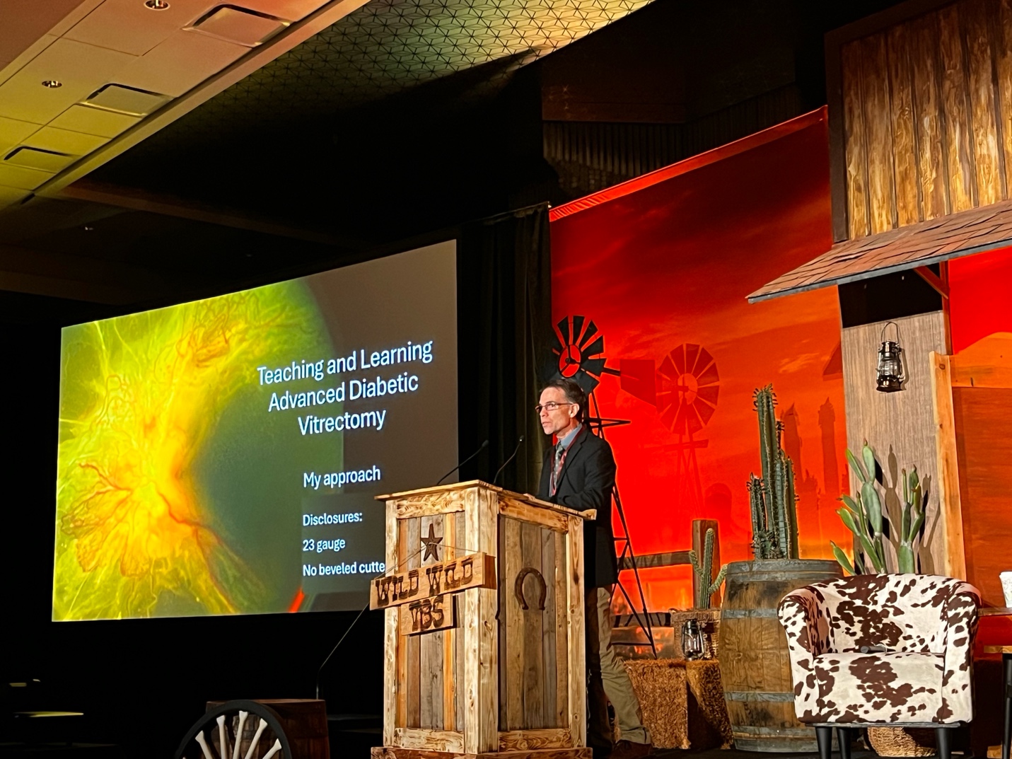 A person standing at a podium Description automatically generated