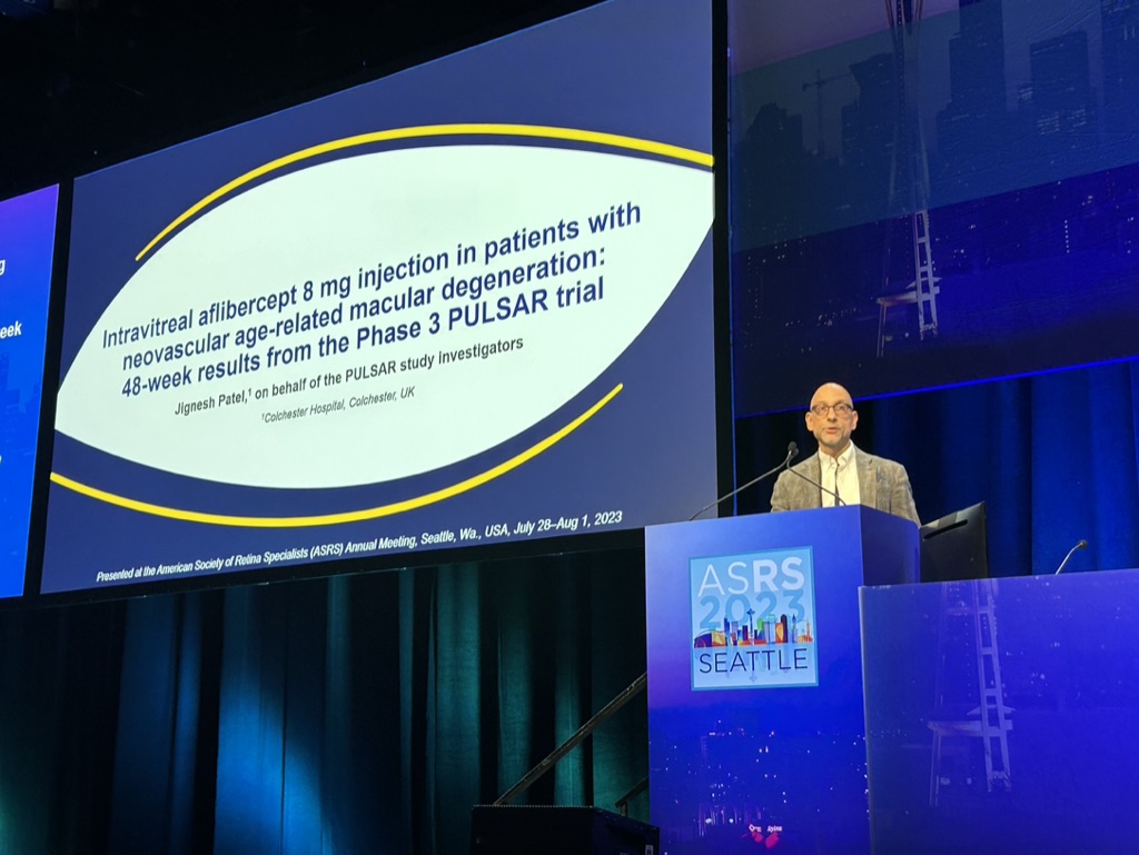 A person standing at a podium Description automatically generated