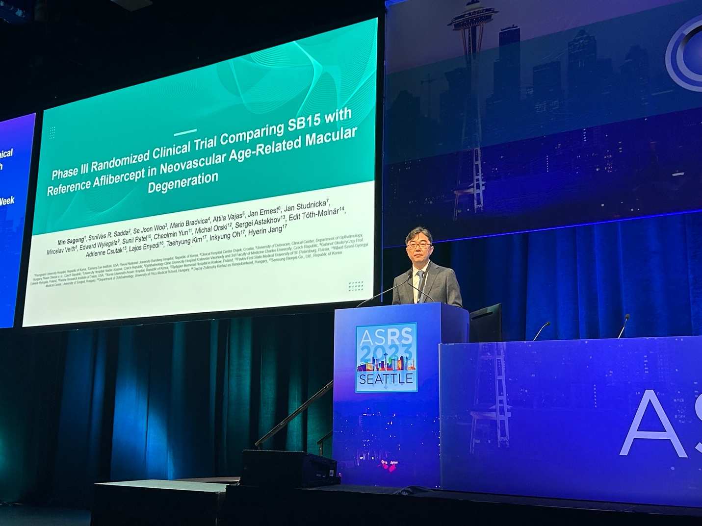 A person standing at a podium Description automatically generated