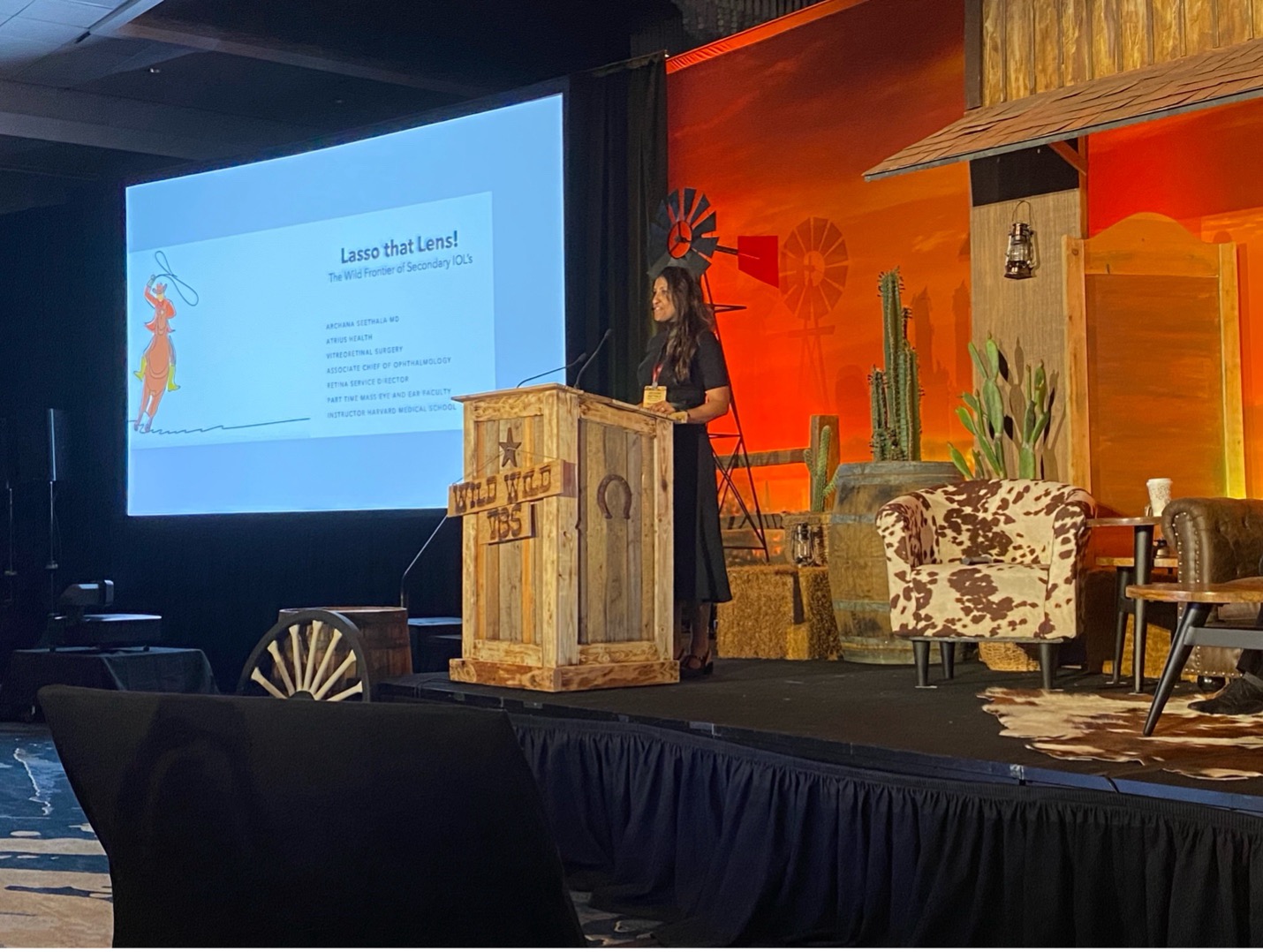 A person standing at a podium Description automatically generated