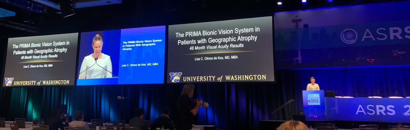 A person standing in front of a screen Description automatically generated