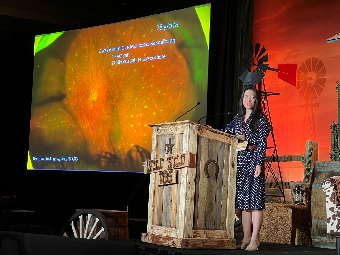 A person standing on a stage Description automatically generated