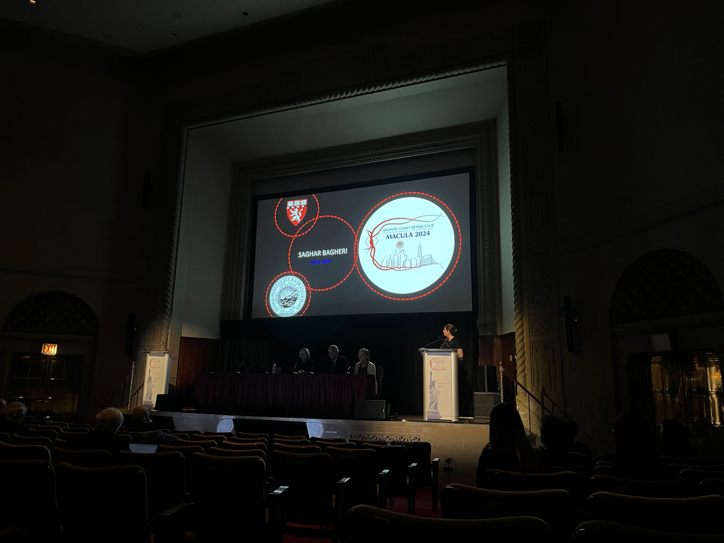 A stage with a large screen Description automatically generated